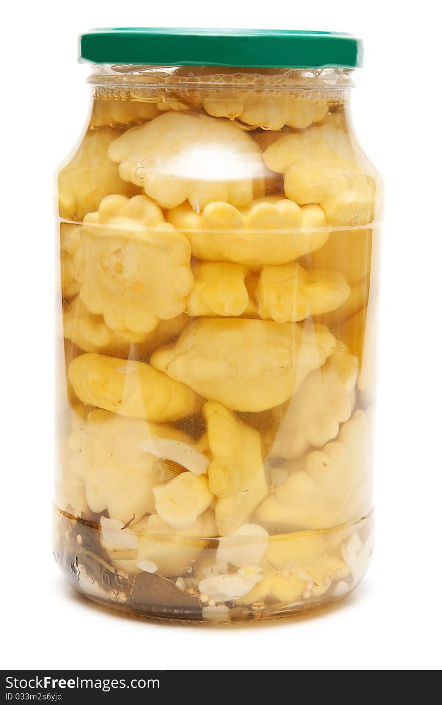 Canned scallops in a glass jar on white background