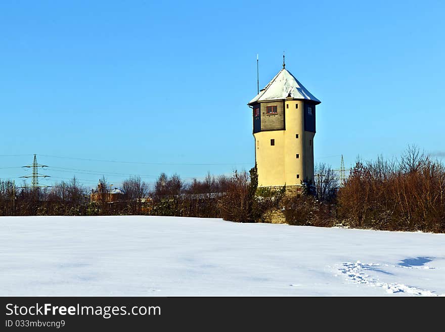 Watertower in  snow covered fields