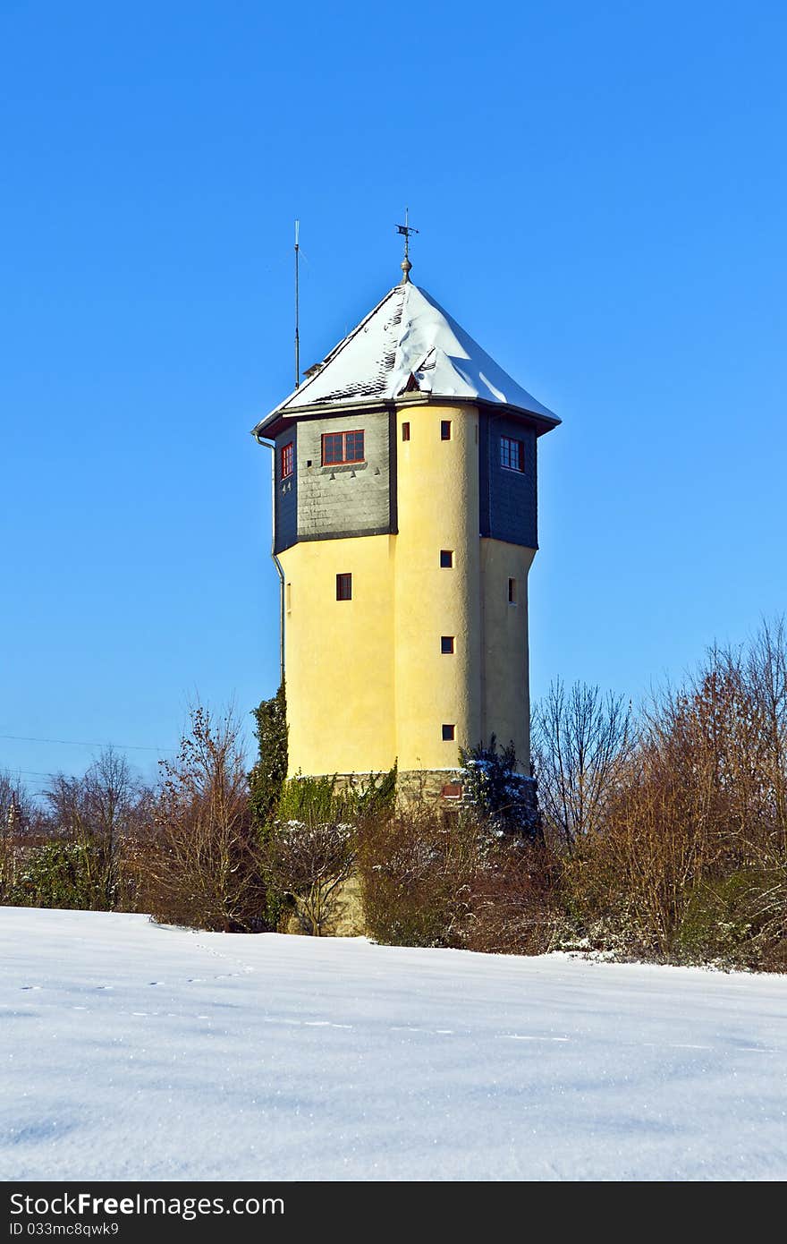 Watertower in  snow covered fields