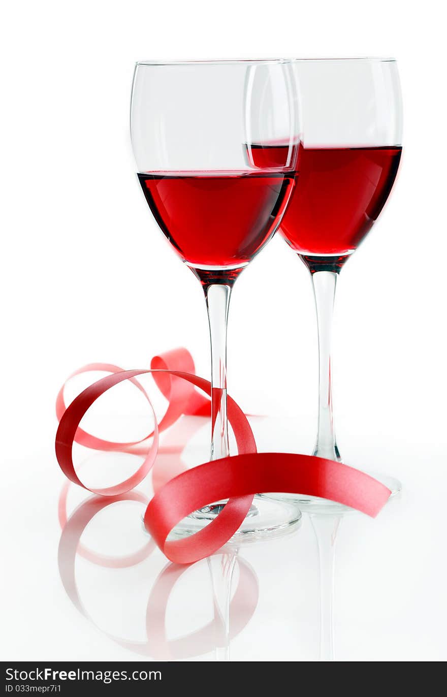 Glass of red wine on a white background and with soft shadow