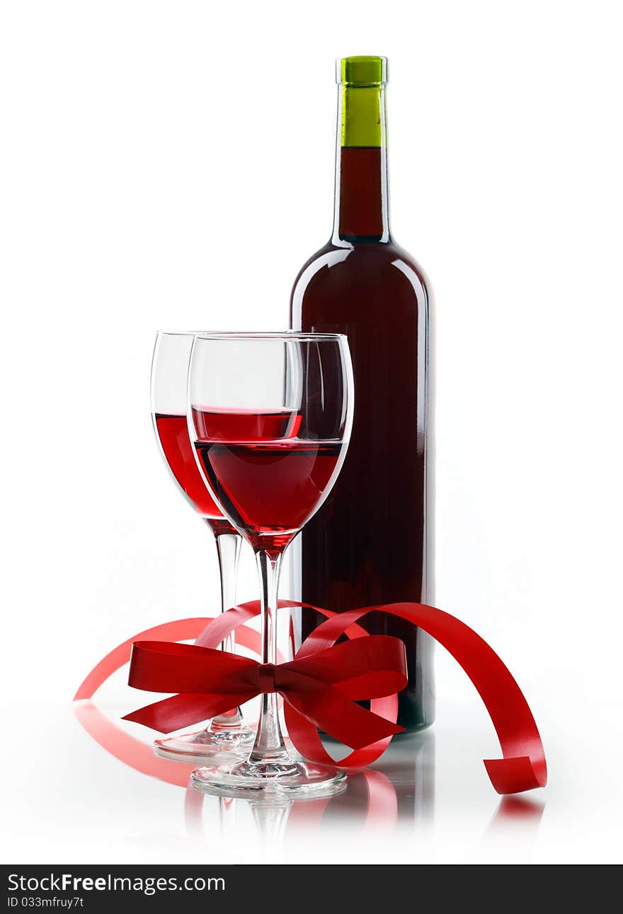 Bottle with red wine and glass