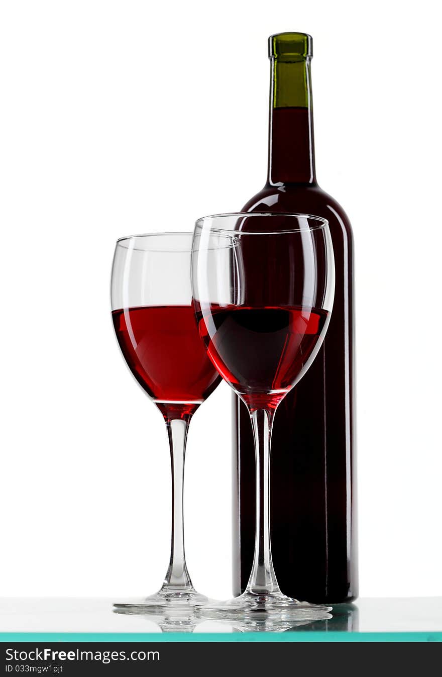 Bottle with red wine and glass