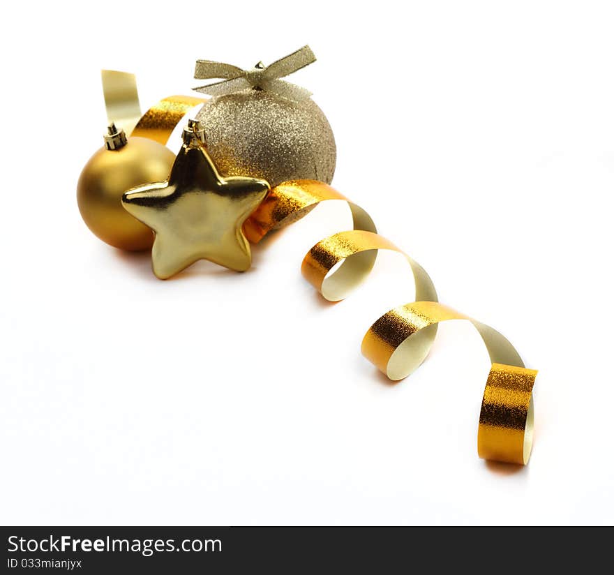 Christmas golden balls hanging with ribbons on white background. Christmas golden balls hanging with ribbons on white background