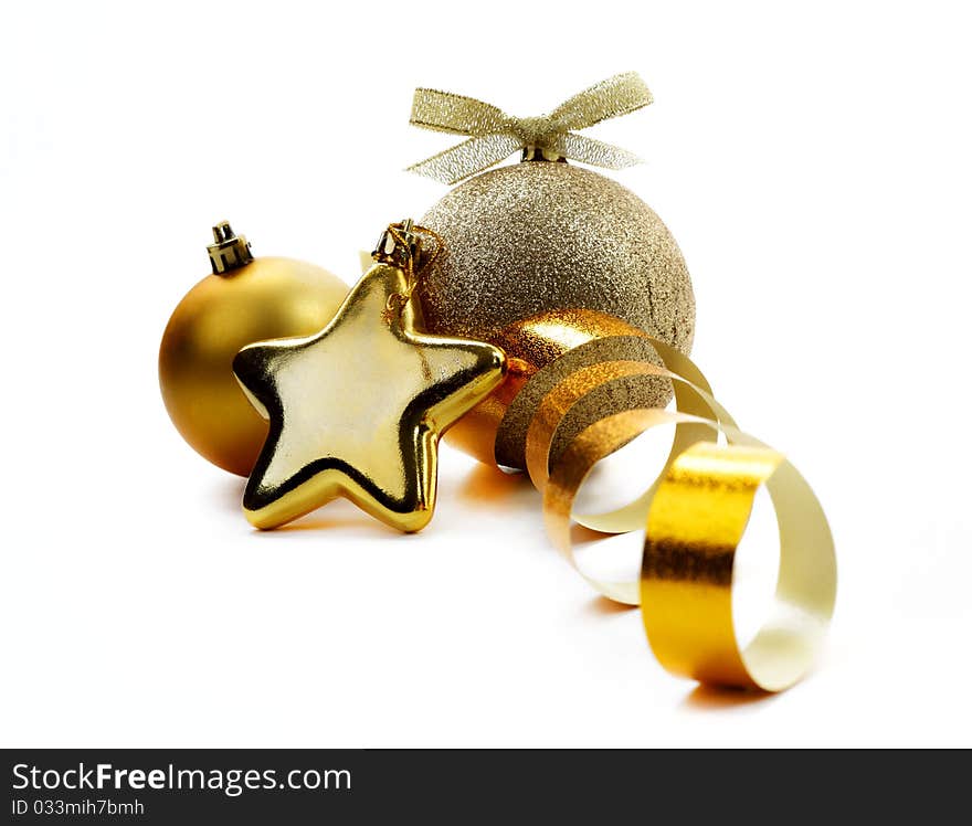 Christmas golden balls hanging with ribbons on white background