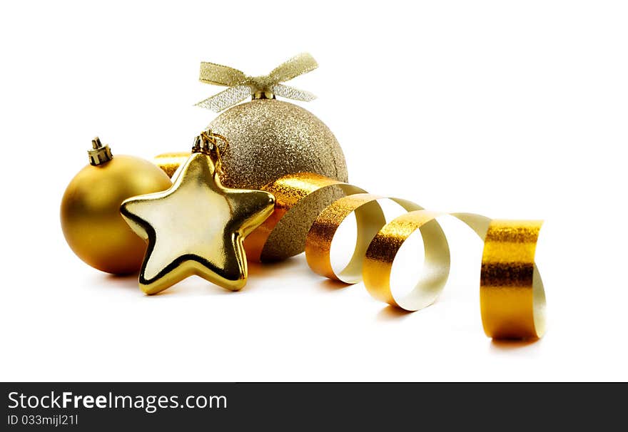 Christmas golden balls hanging with ribbons on white background