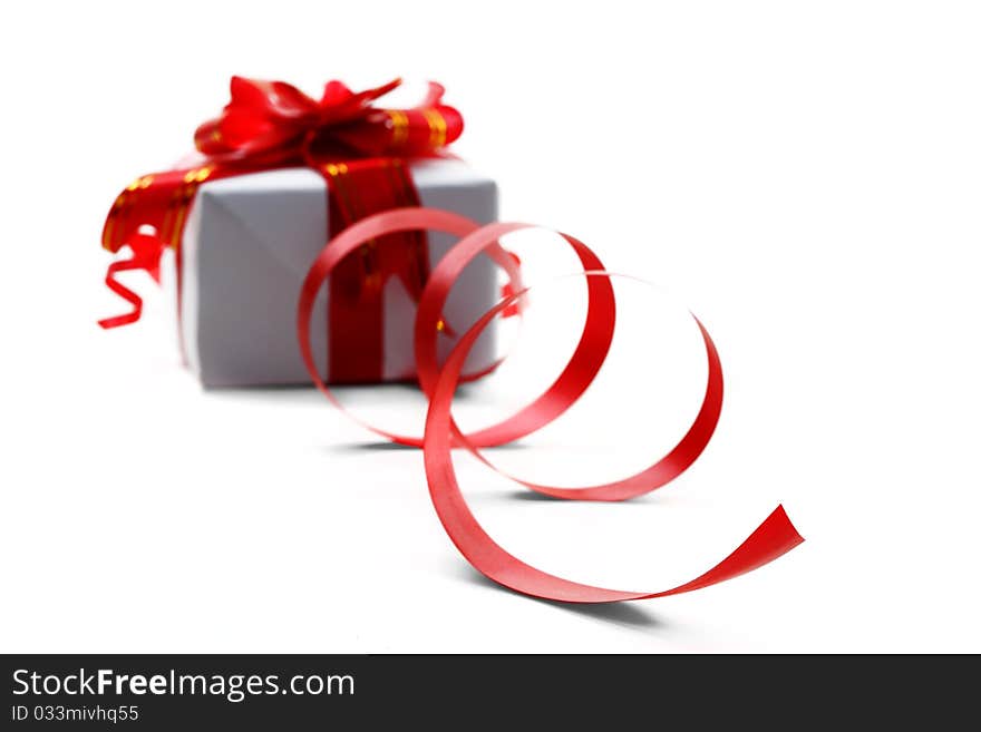 Gift box with red bow isolated on white