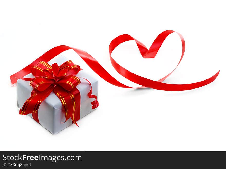 Gift box with red bow isolated on white