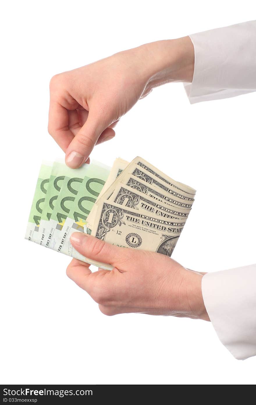 Close-up of female hands holding banknotes: choosing euro; isolated on white