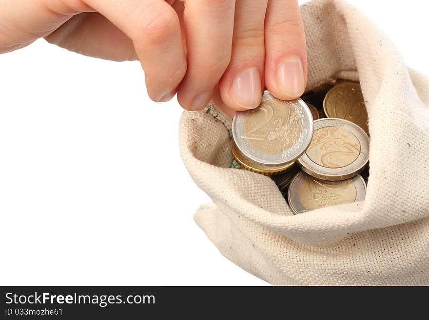 Close-up of a sack filled with coins isolated on neutral background