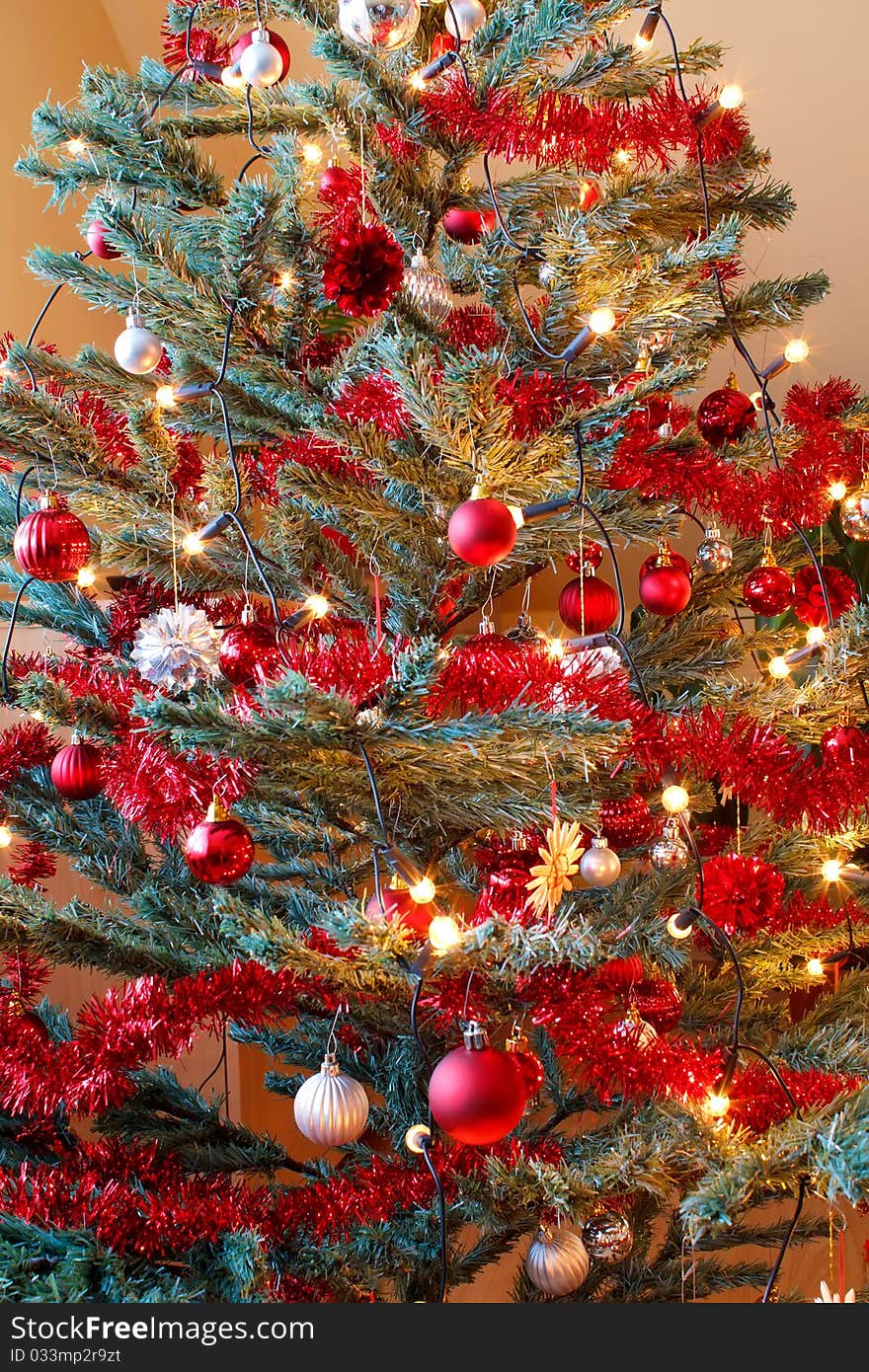 Red Christmas decoration on tree with light