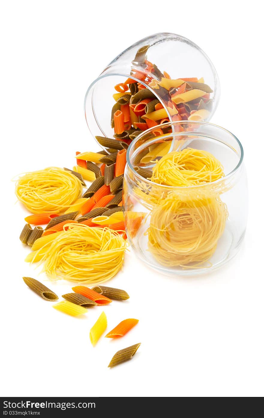 Pasta in glass jar on a white background