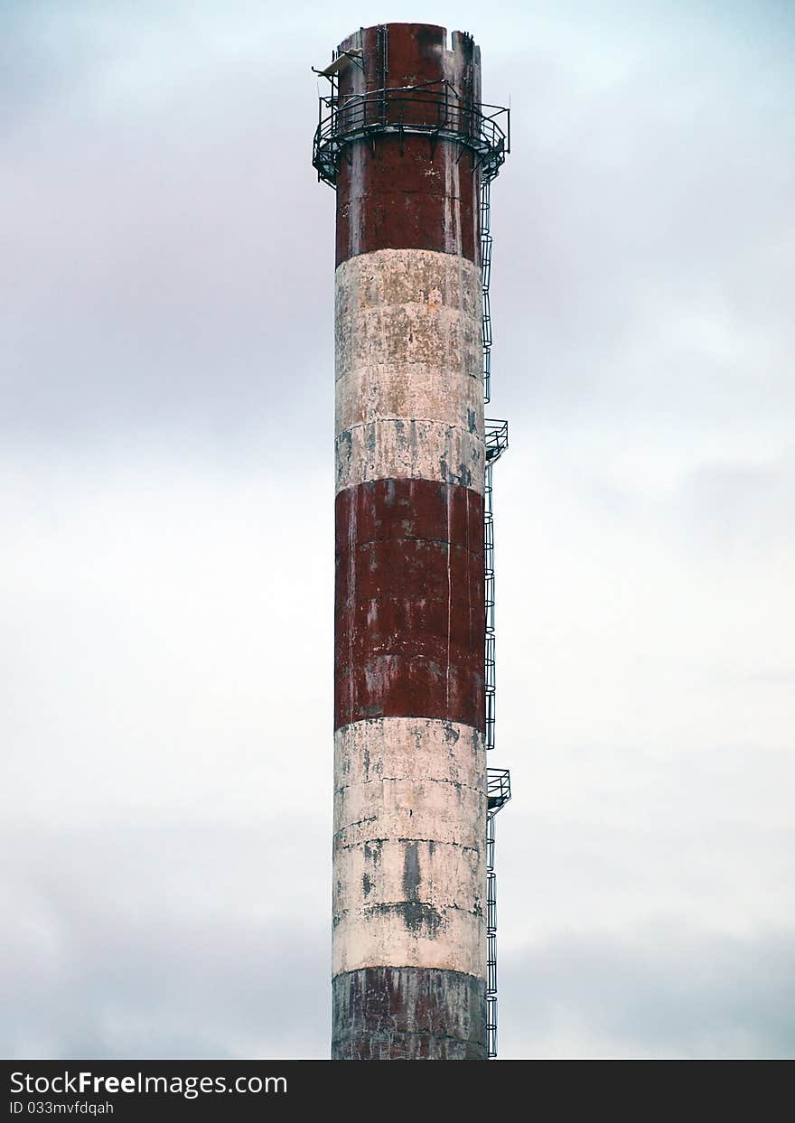 Urban and old smokestack with sky background