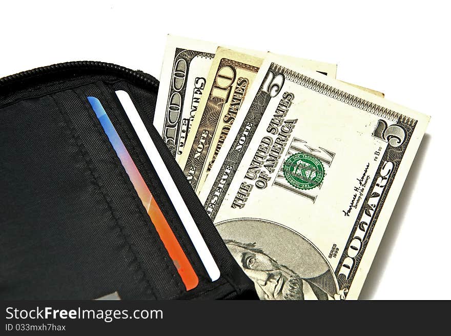 Several dollar bills in purse on a white background