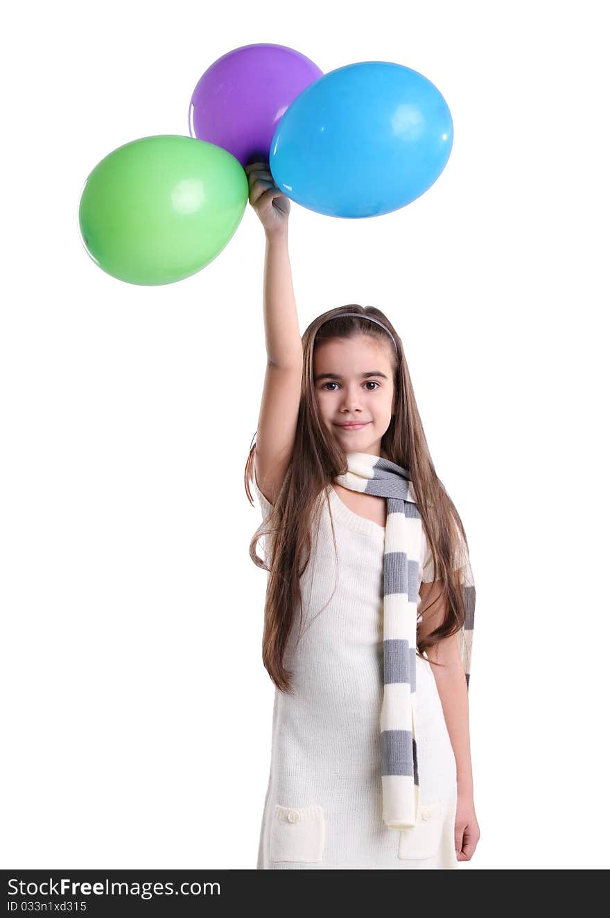 Little smiling girl with balloons in the studio