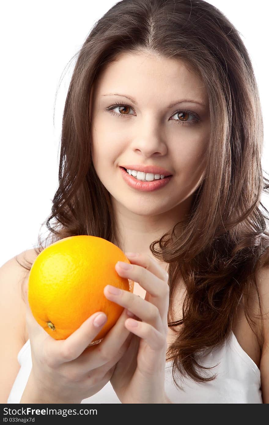 Beautiful young woman holding an orange. Close up. Beautiful young woman holding an orange. Close up