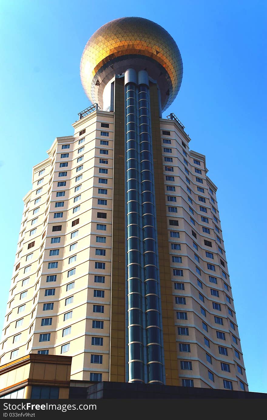 A skyscrpaer in the blue sky. A skyscrpaer in the blue sky