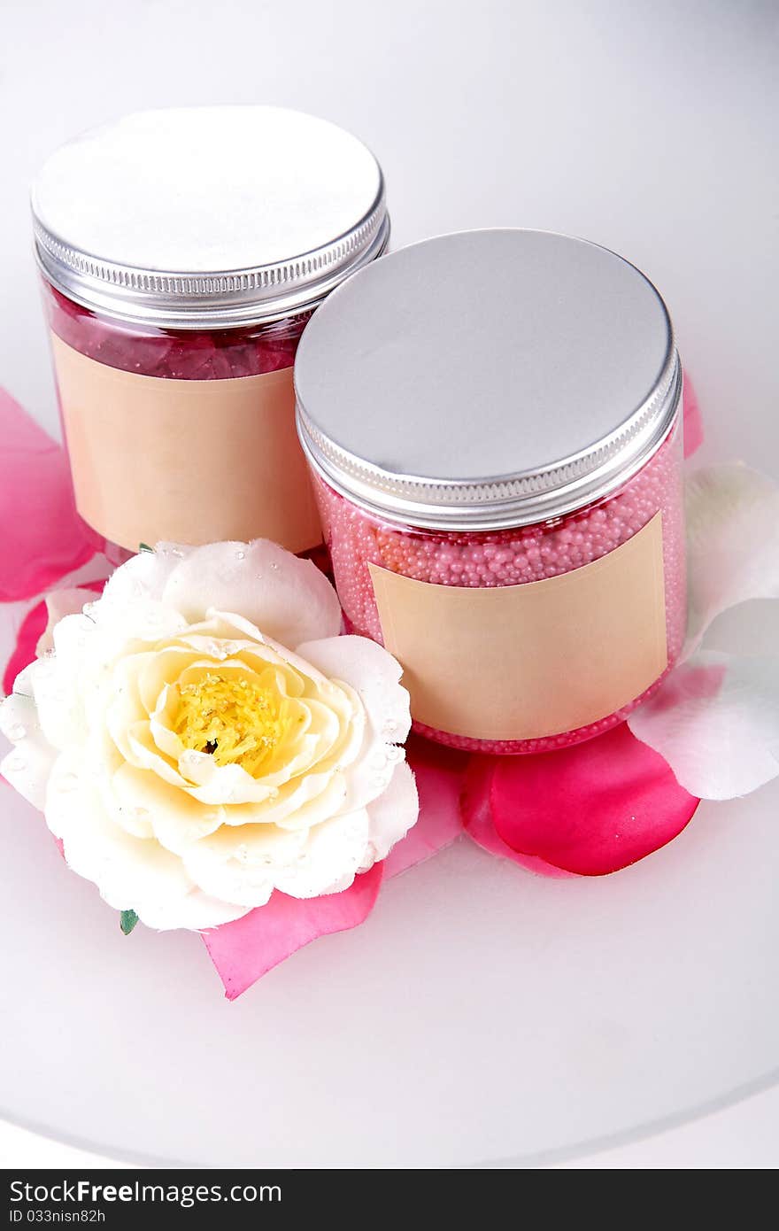 Bottles of bathing salt and flower