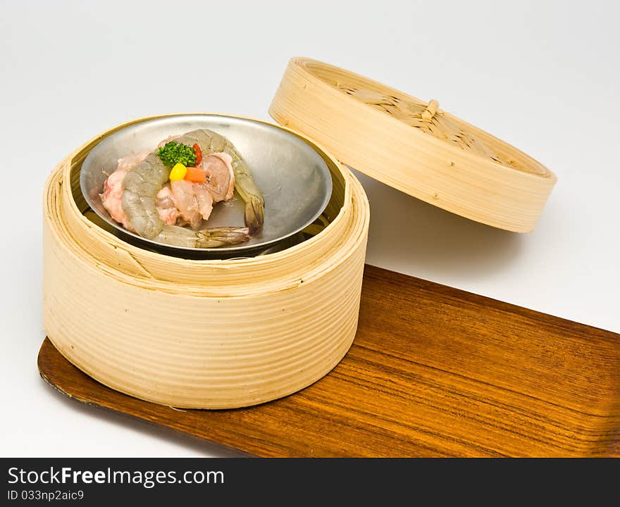 Chinese steamed shrimp dimsum in bamboo containers traditional cuisine. Chinese steamed shrimp dimsum in bamboo containers traditional cuisine