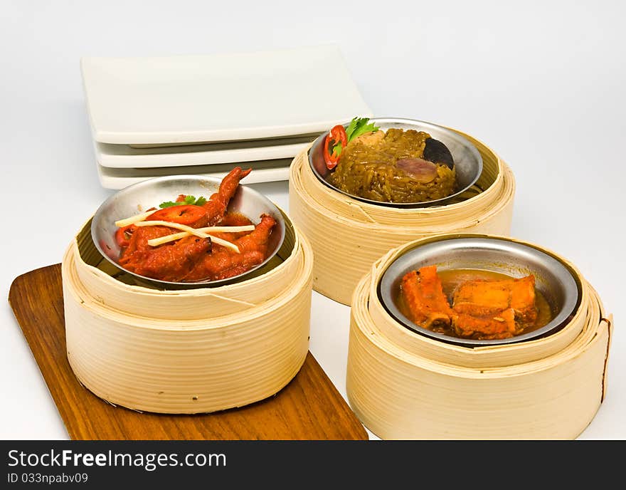 Chinese steamed dimsum in bamboo containers traditional cuisine. Chinese steamed dimsum in bamboo containers traditional cuisine