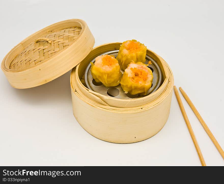 Chinese steamed spawn dimsum in bamboo containers traditional cuisine. Chinese steamed spawn dimsum in bamboo containers traditional cuisine