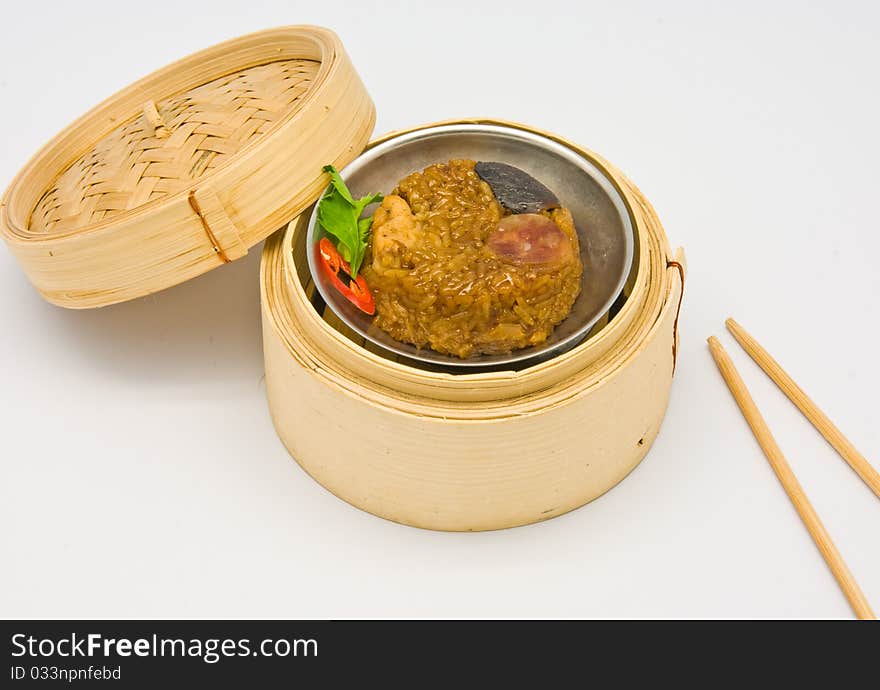 Chinese streamed rice dimsum in bamboo containers traditional cuisine. Chinese streamed rice dimsum in bamboo containers traditional cuisine