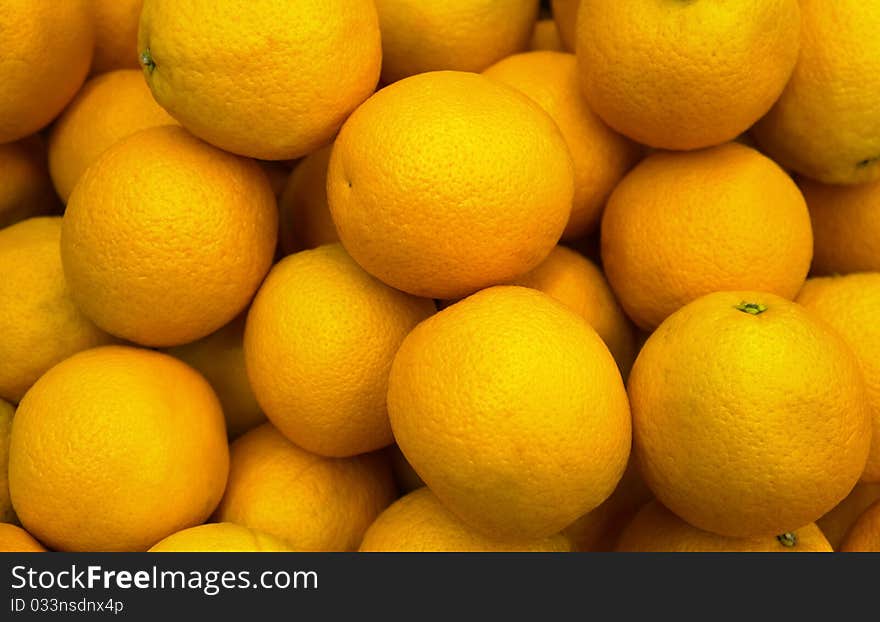 Lots of fresh oranges on market place. Lots of fresh oranges on market place