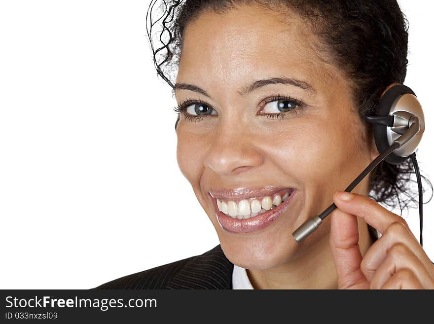 Smiling attractive woman makes with headset a call. Isolated on white background.