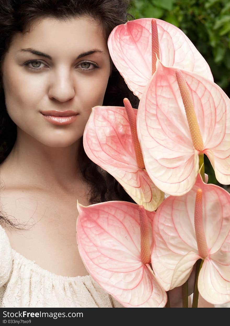 Closeup shot of pretty girl with pink flowers. Closeup shot of pretty girl with pink flowers