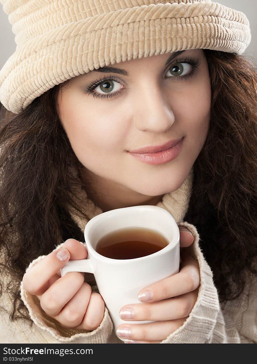 Pretty girl with cup of tea