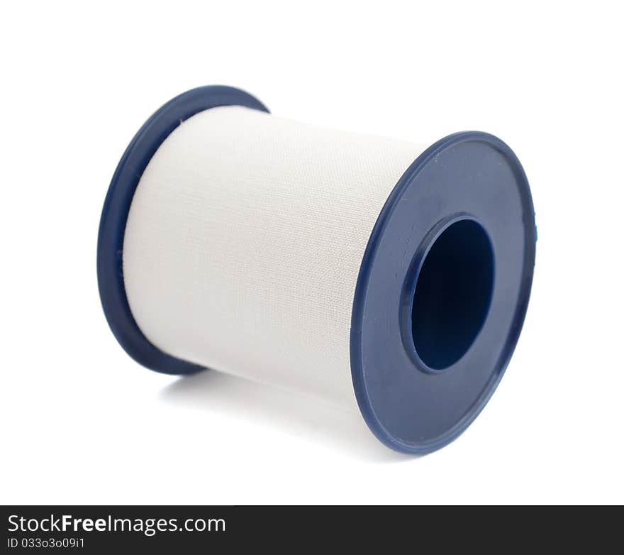 Roll of medical sticking plaster isolated on white