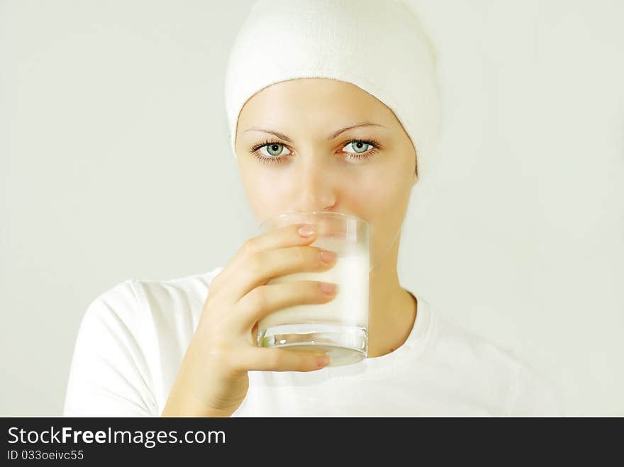 Beautiful young woman drinking milk. Beautiful young woman drinking milk