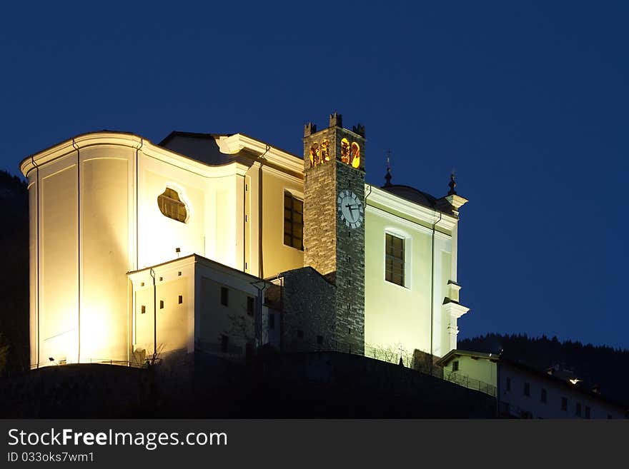 San Faustino Church during the first part of the night. Malonno village, Brixia province, Lombardy region, Italy. San Faustino Church during the first part of the night. Malonno village, Brixia province, Lombardy region, Italy