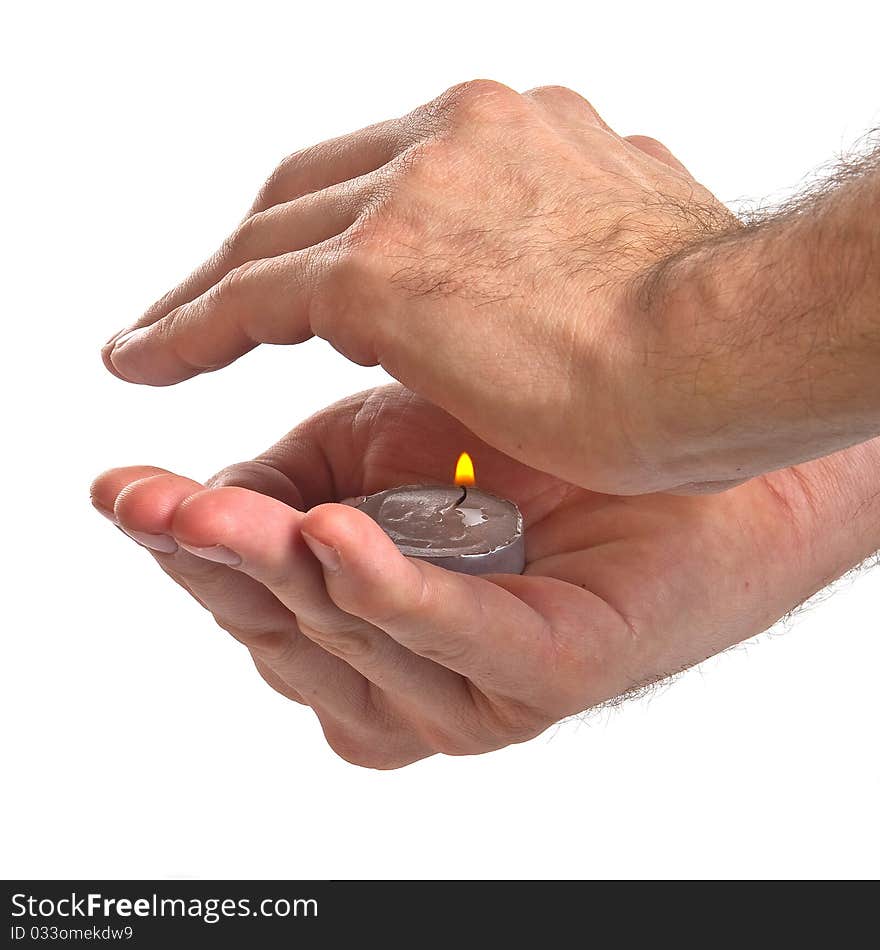 Candle in the hands, against white background