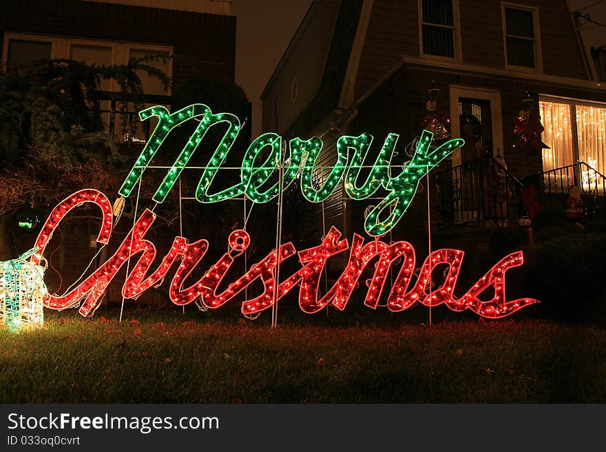 The house decoration with christmas light and sign merry christmas. The house decoration with christmas light and sign merry christmas