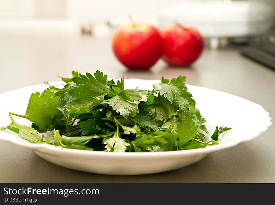 Freshly chopped parsley on a white plate