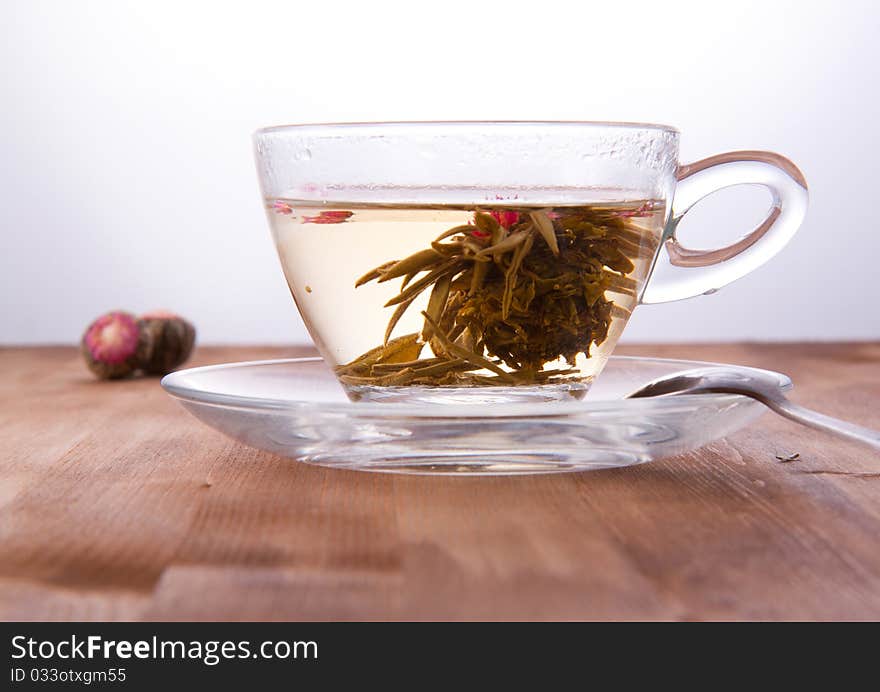 Transparent cup of green tea