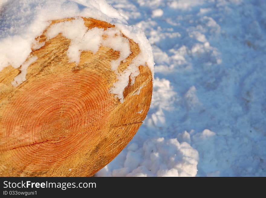 A piece of wood with snow