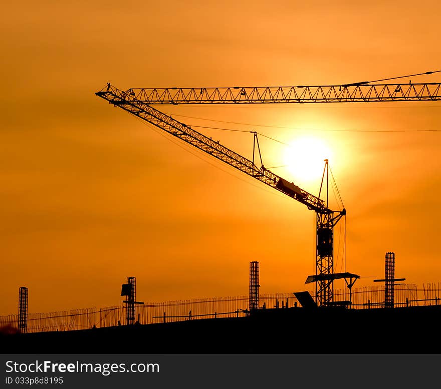 Crane For Construction And Sunset