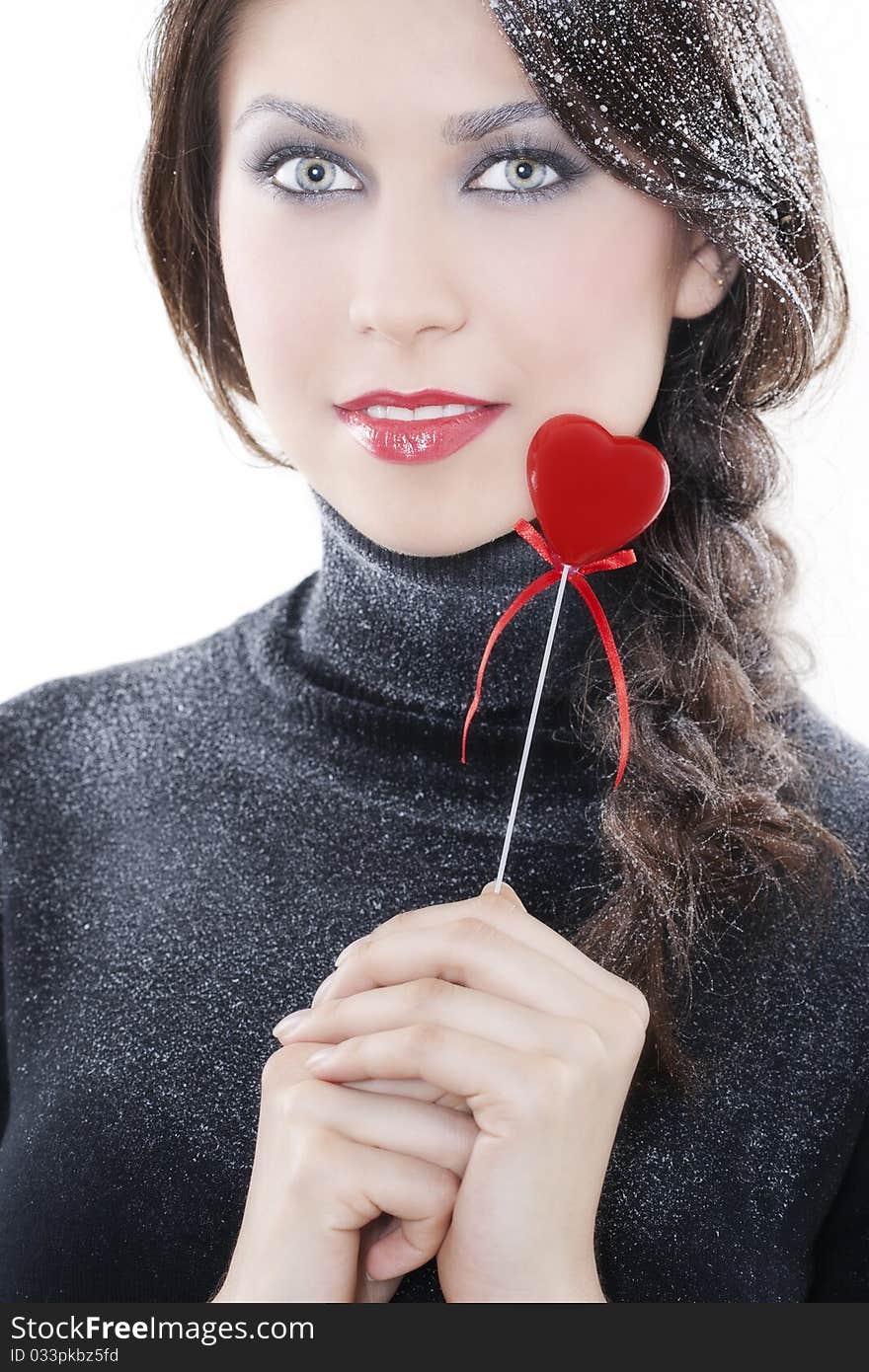 Beautiful smiling woman with heart on white background