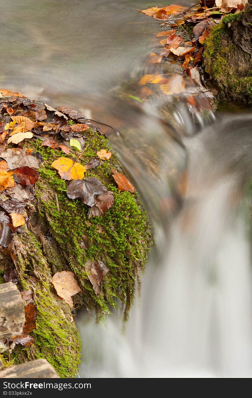 Beautiful cascade waterfall in autumn forest