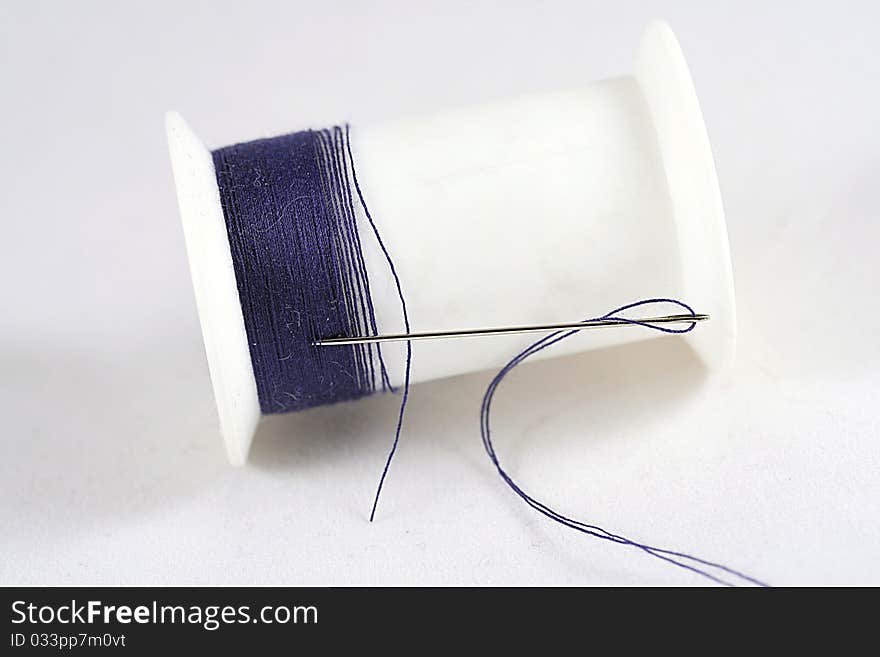 Close up of needle and thread.