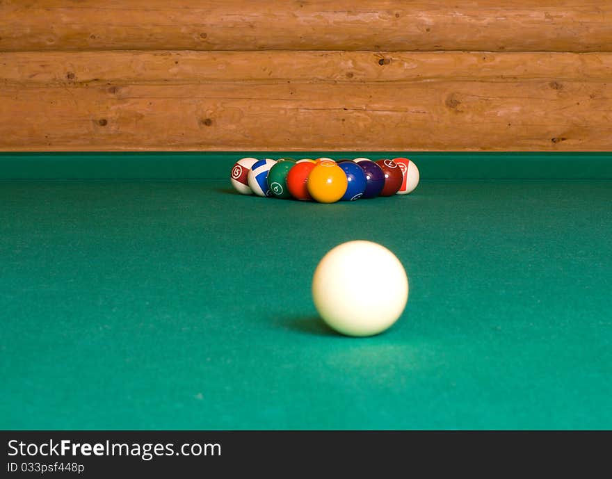 Pool balls on a billiard table before the starting hit. Pool balls on a billiard table before the starting hit.