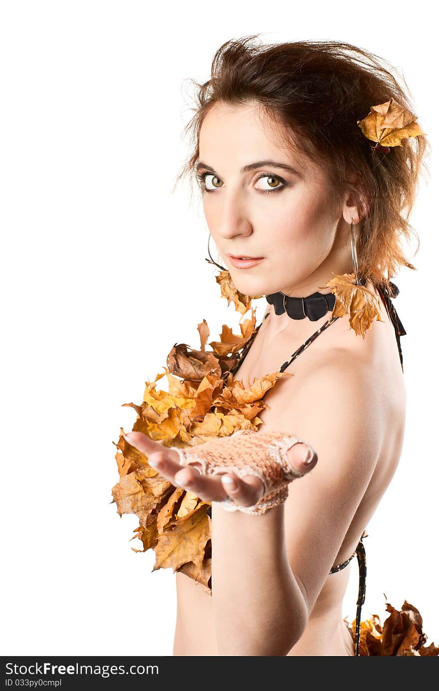 Portrait of beautiful, young sexy girl in lingerie made of leaves. White background. Studio shot. Portrait of beautiful, young sexy girl in lingerie made of leaves. White background. Studio shot.