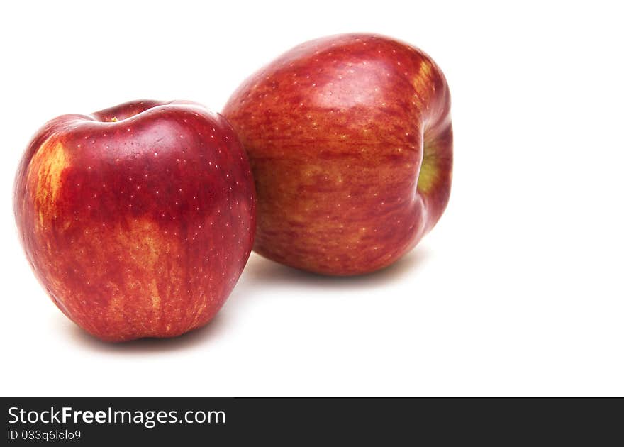 Two juicy red apples isolated on white