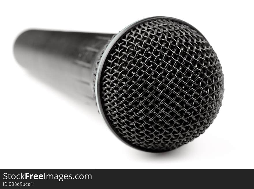 A black microphone isolated on a white background