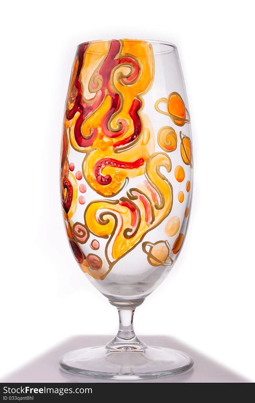 Design glass decorated in red, orange and yellow and isolated on white. Design glass decorated in red, orange and yellow and isolated on white