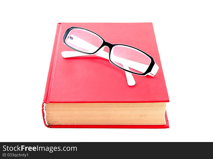 Book with glasses isolated on white background. Book with glasses isolated on white background