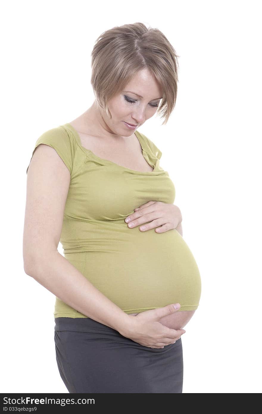 Pregnant pretty woman in studio over white background. Pregnant pretty woman in studio over white background