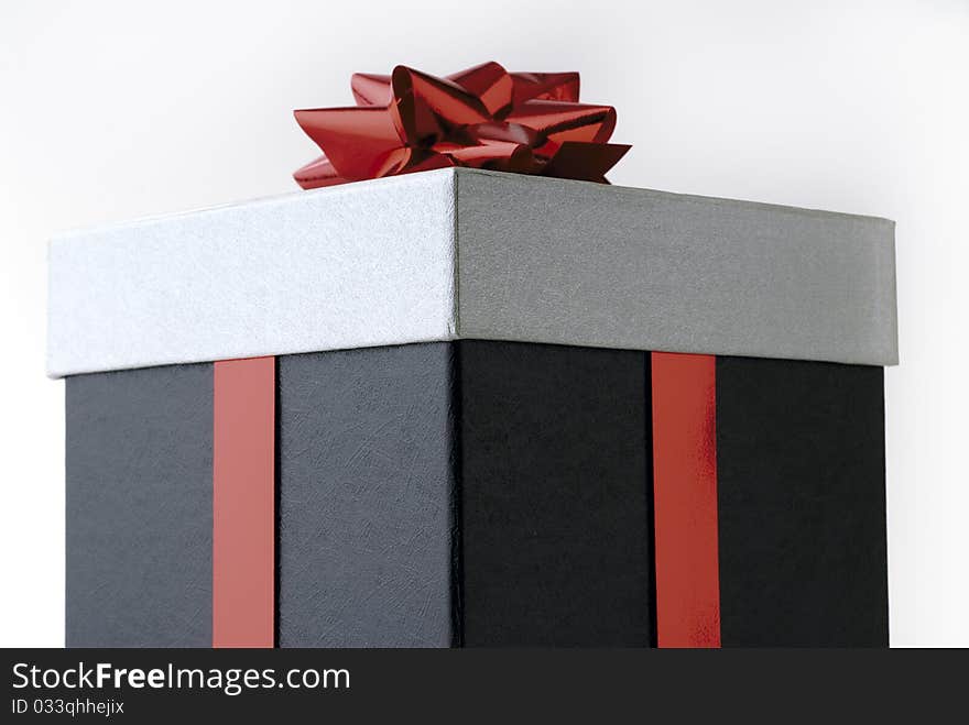 Gift in a box with red ribbon