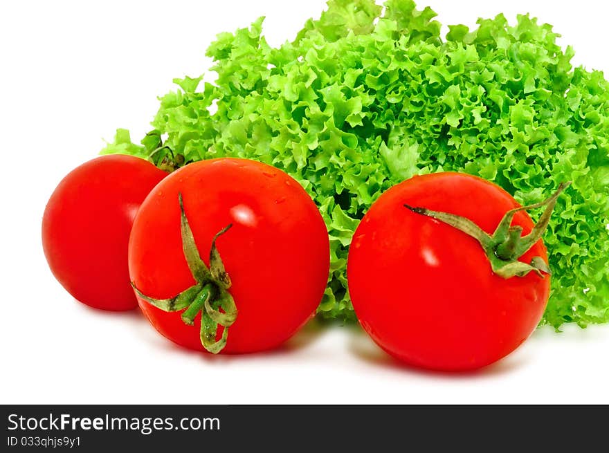 Red Tomatoes And Green Lettuce, Isolated On White